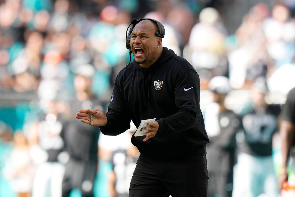 Las Vegas Raiders interim head coach Antonio Pierce gestures during the first half of an NFL fo ...