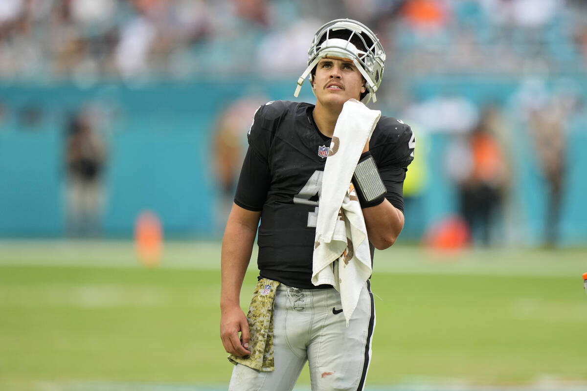 Las Vegas Raiders quarterback Aidan O'Connell (4) looks up during a time out during the second ...