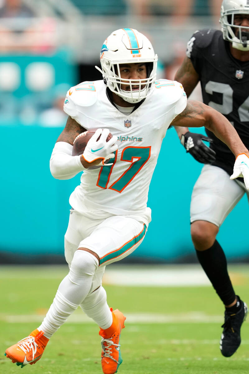 Miami Dolphins wide receiver Jaylen Waddle (17) runs the ball during the first half of an NFL f ...
