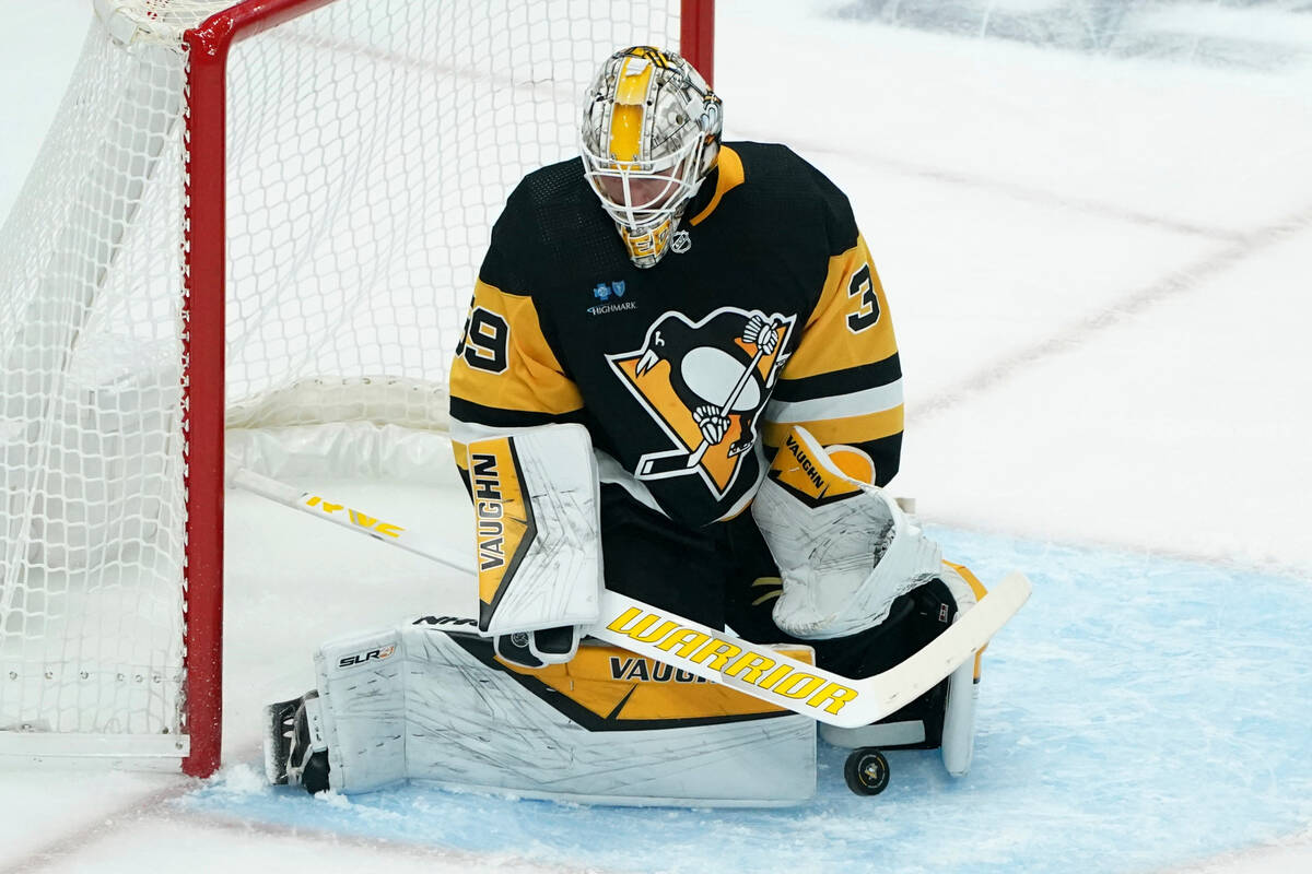 Pittsburgh goaltender Alex Nedeljkovic makes a save against the Vegas Golden Knights during the ...
