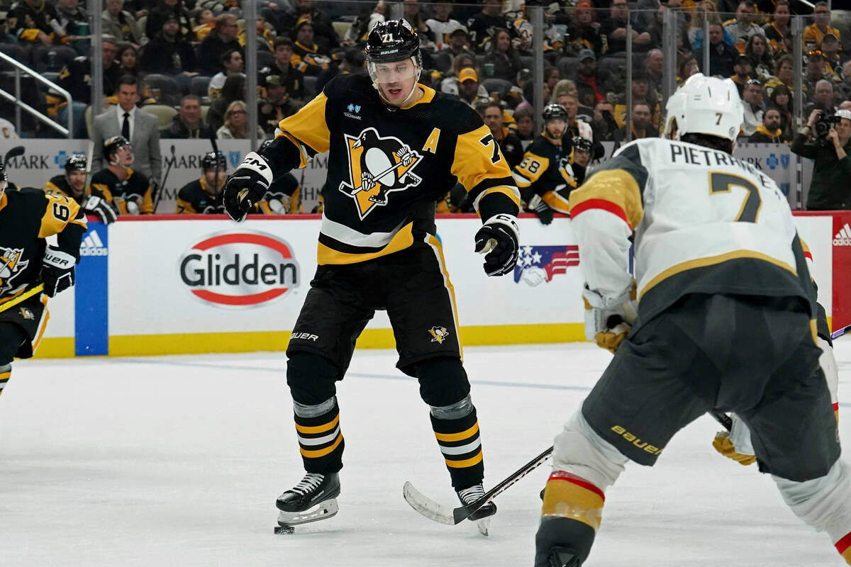 Pittsburgh Penguins' Evgeni Malkin (71) controls the puck with his skate after losing his stick ...
