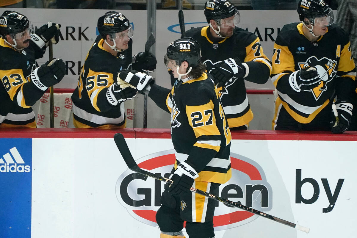 Pittsburgh Penguins' Ryan Graves (27) returns to the bench after scoring a goal against the Veg ...