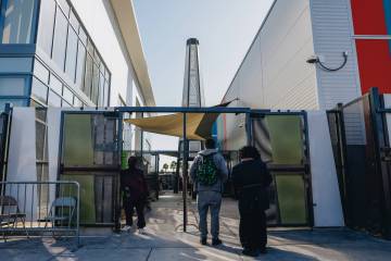 People enter the Courtyard Homeless Resource Center, seen here on Oct. 28, 2023, in Las Vegas. ...