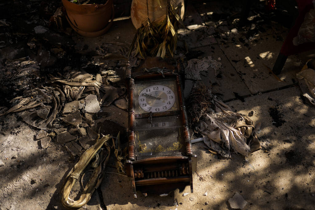 A damaged clock outside a home that came under attack during a massive Hamas invasion into Kibb ...