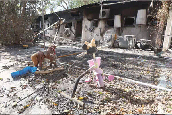Debris outside a home in Nir Oz. (Photo: Oren Cohen via Israel Hayom)