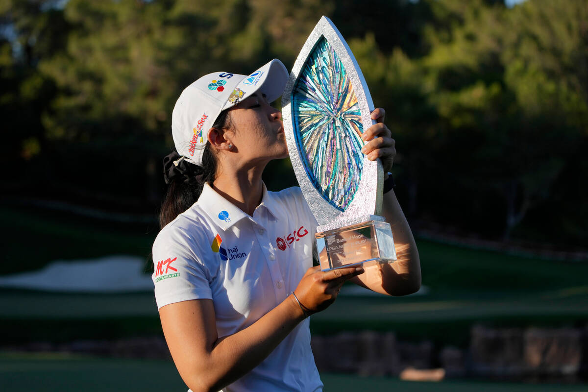 Pajaree Anannarukarn kisses the trophy while posing for photographers after winning the LPGA Ba ...