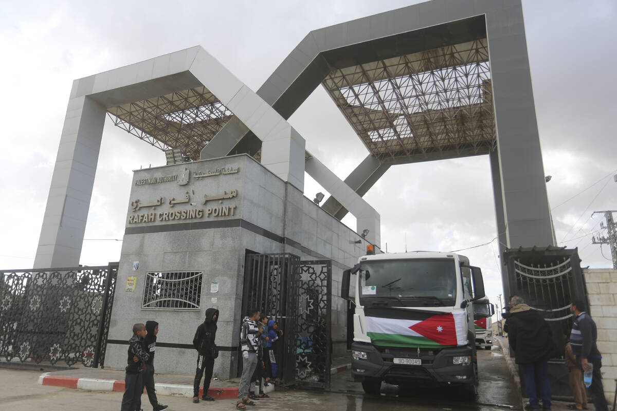 A Jordanian humanitarian aid convoy enters the Gaza Strip from Egypt in Rafah on Monday, Nov. 2 ...