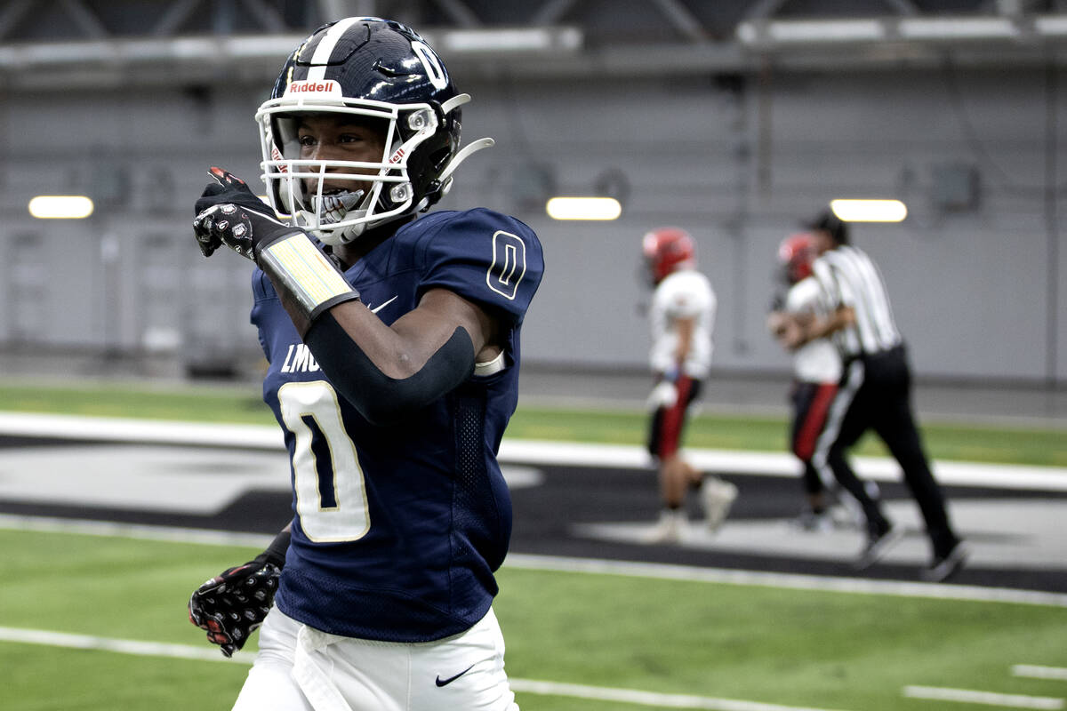 Lake Mead wide receiver Antonio Spann (0) celebrates his touchdown during the first half of a C ...