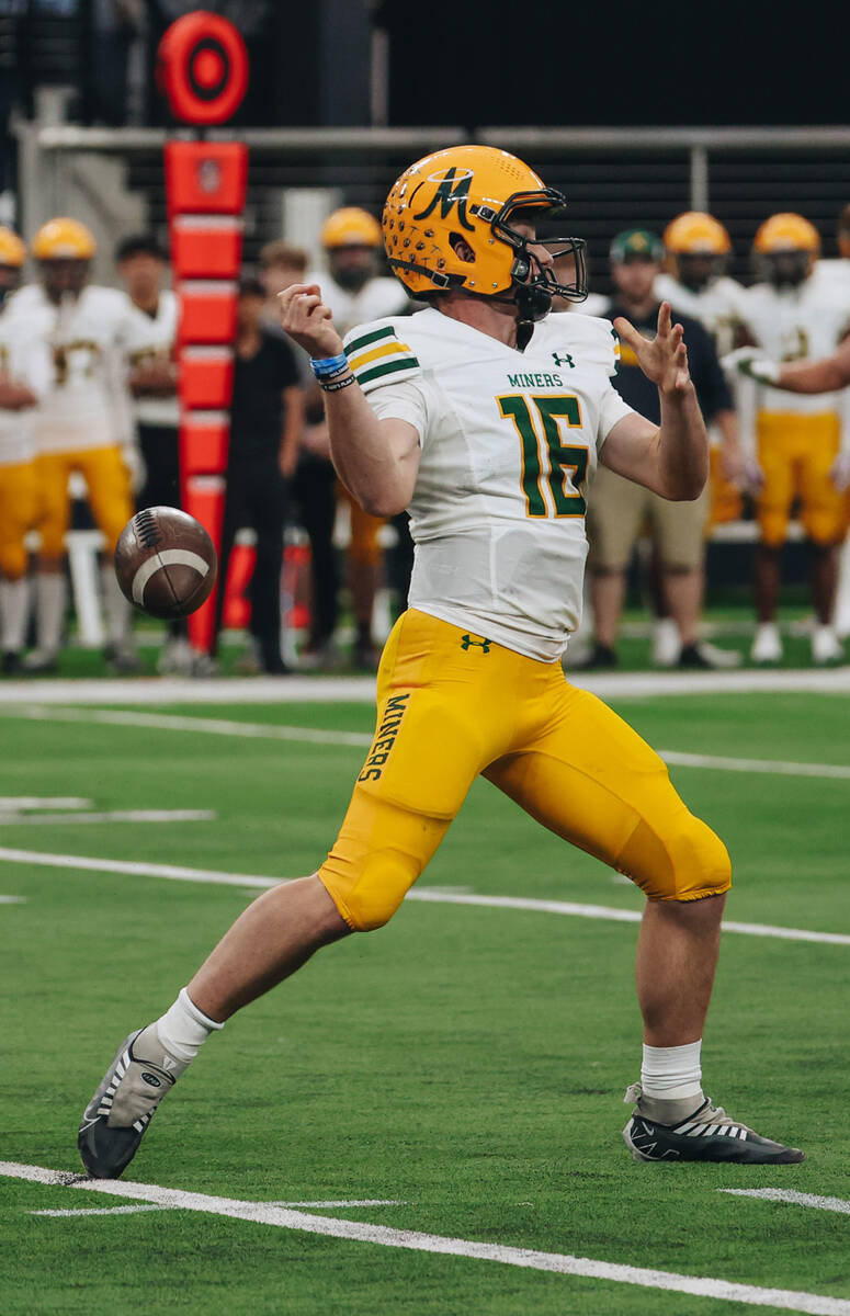 Bishop Manogue quarterback pHILIP Jacobs loses the ball as he attempts to throw it to a teammat ...