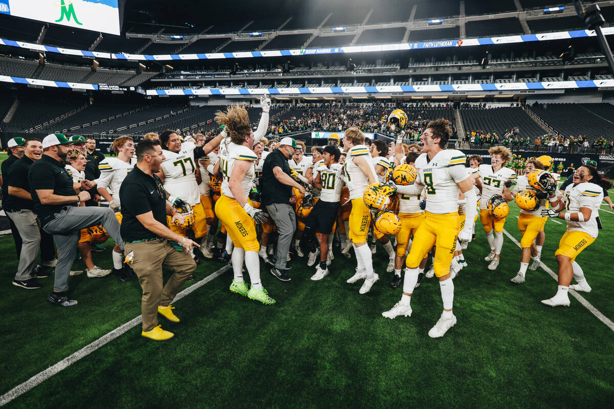 Bishop Manogue celebrates after winning a class 5A Division II state championship game against ...