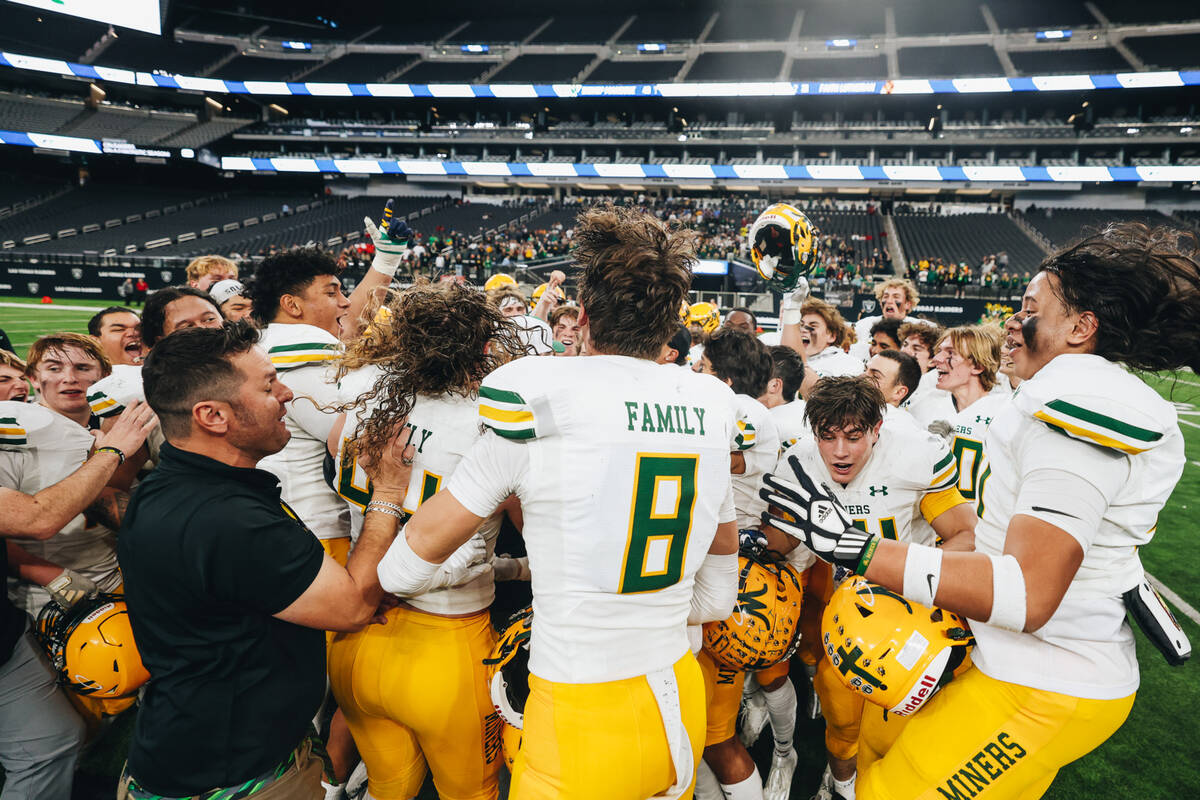 Bishop Manogue celebrates after winning a class 5A Division II state championship game against ...