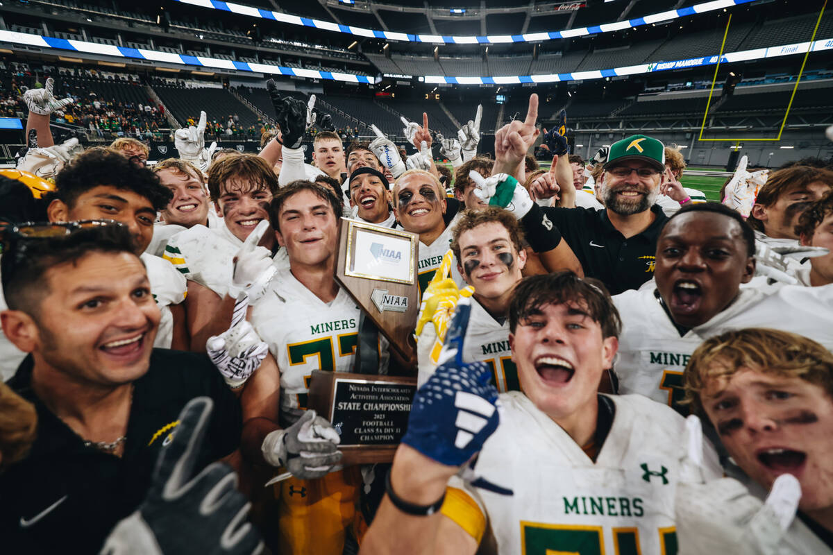Bishop Manogue celebrates after winning a class 5A Division II state championship game against ...