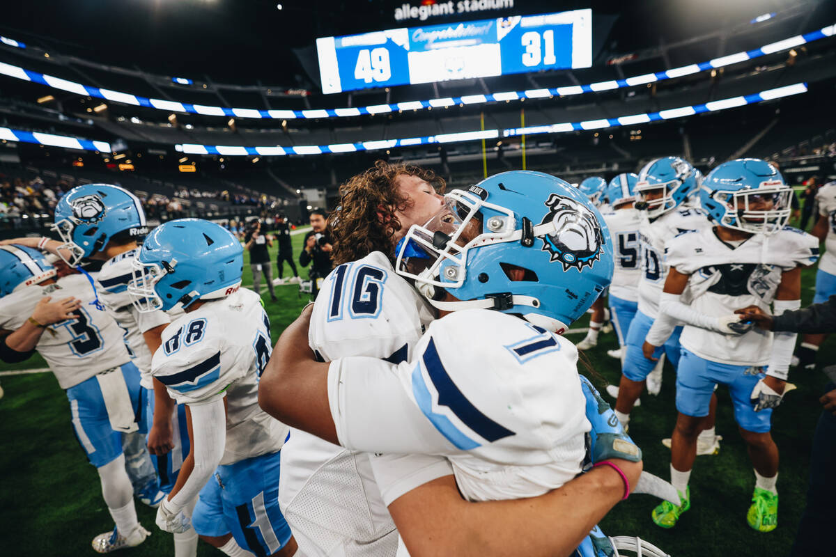 Centennial players celebrate a state championship win over Sunrise Mountain during a class 4A s ...