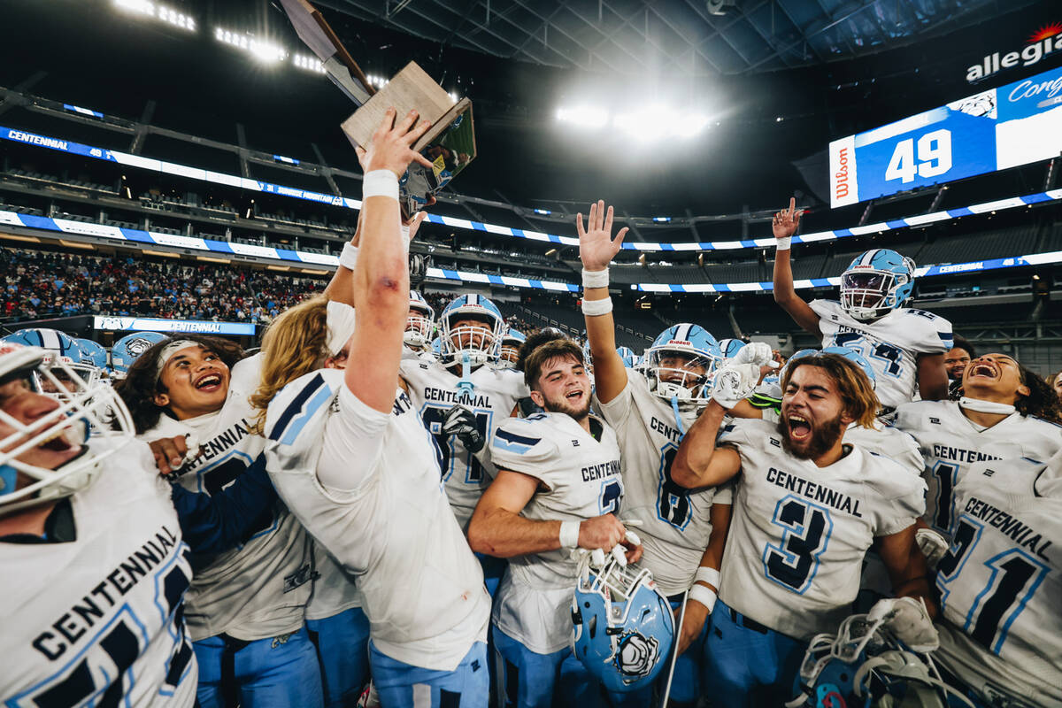 Centennial players celebrate a state championship win over Sunrise Mountain during a class 4A s ...