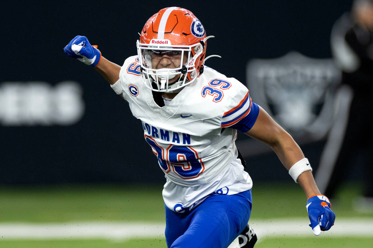 Bishop Gorman defensive back Myles Baker (39) celebrates a big hit on Liberty during the first ...