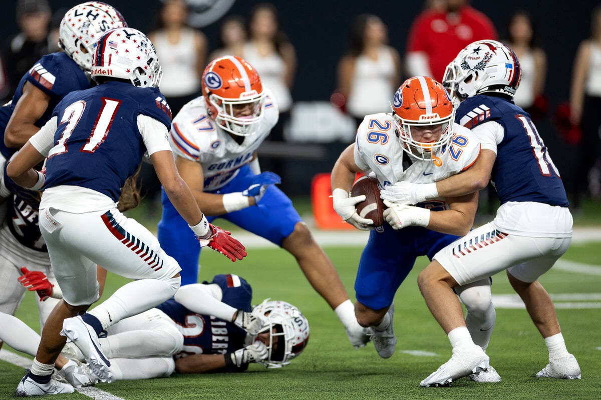Bishop Gorman linebacker Aksel Ferry (26) recovers a Liberty fumble during the second half of a ...