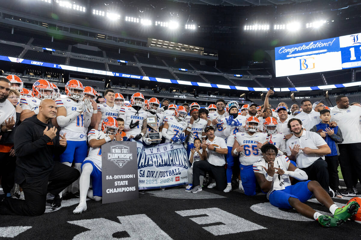 Bishop Gorman poses for photos after winning the Class 5A Division I high school football state ...