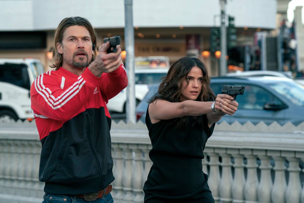 Nick Zano as Chad McKnight and Shelley Hennig are shown filming "Obliterated" on the Strip. (Ur ...