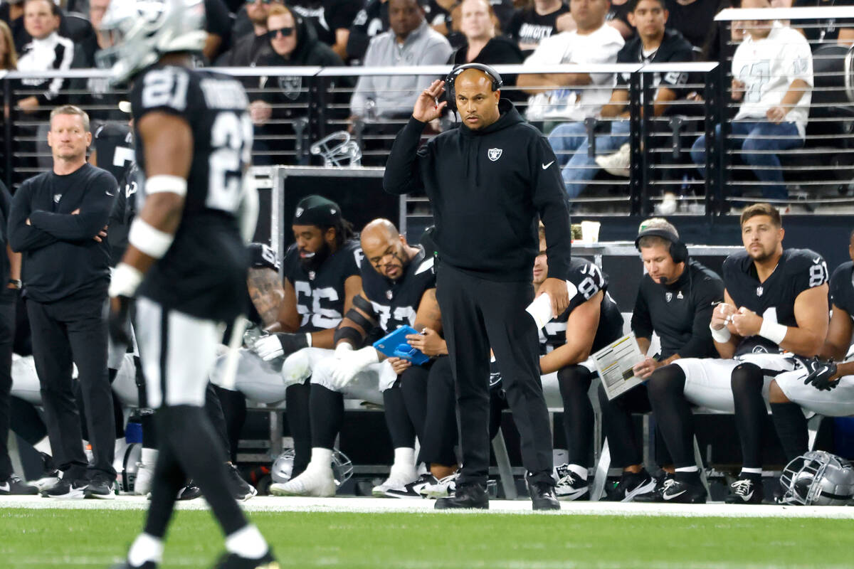 Raiders Interim Coach Antonio Pierce watches his players during the first half of an NFL footba ...