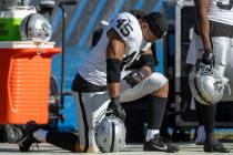 Raiders fullback Jakob Johnson (45) bows his head on the sideline during the second half an NFL ...