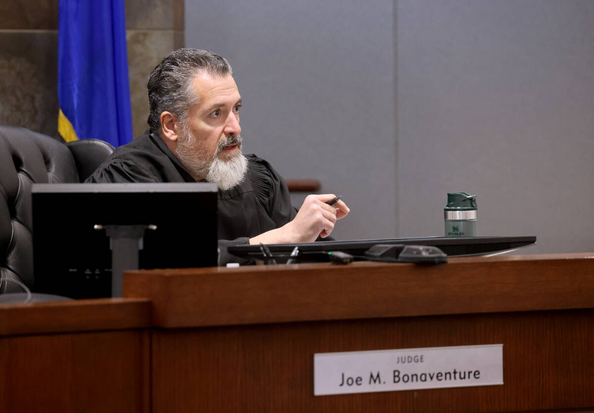 Judge Joe Bonaventure speaks to Johnelle Johnson, a Regional Transportation Commission bus driv ...