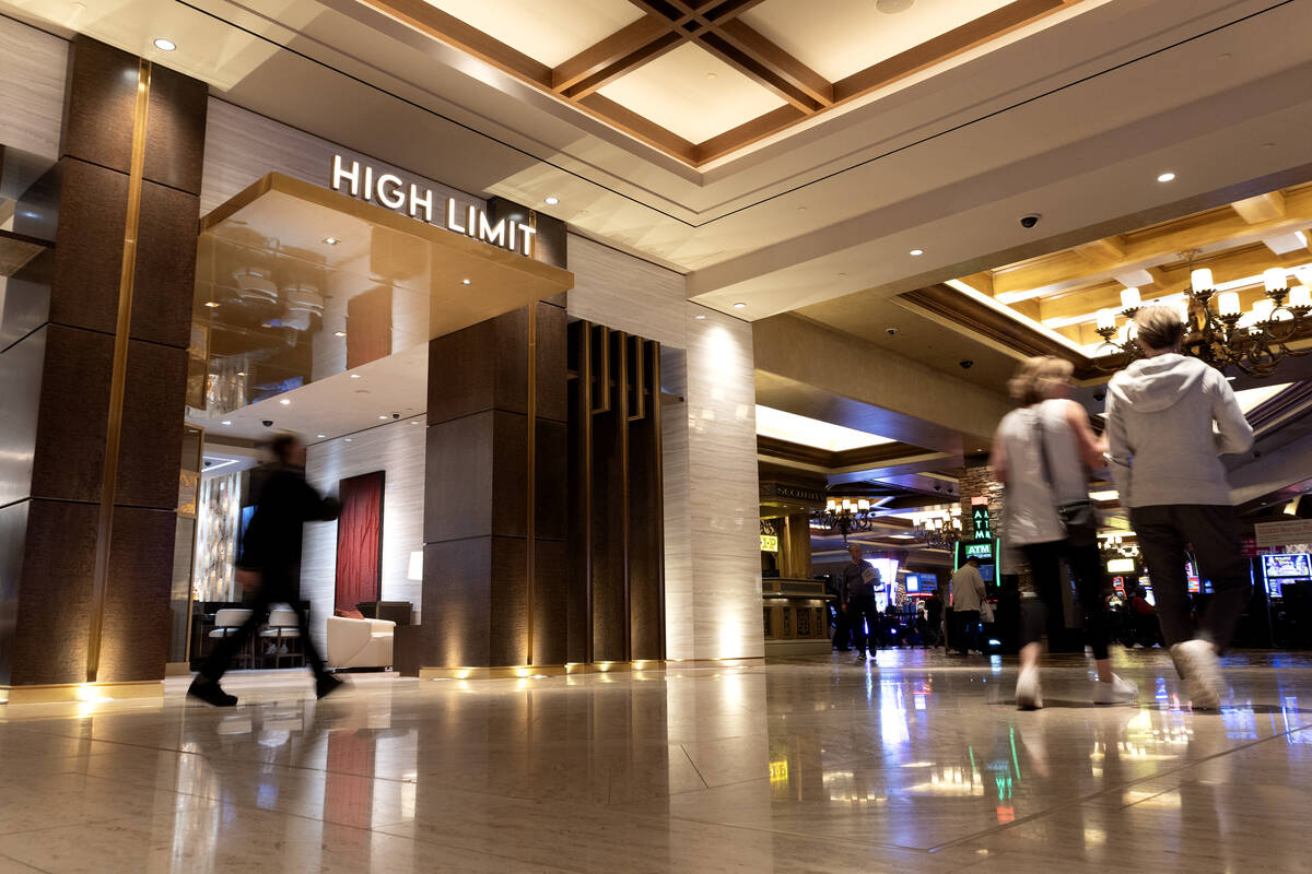 Visitors to Green Valley Ranch resort-casino walk past a new high limit slot lounge on Wednesda ...