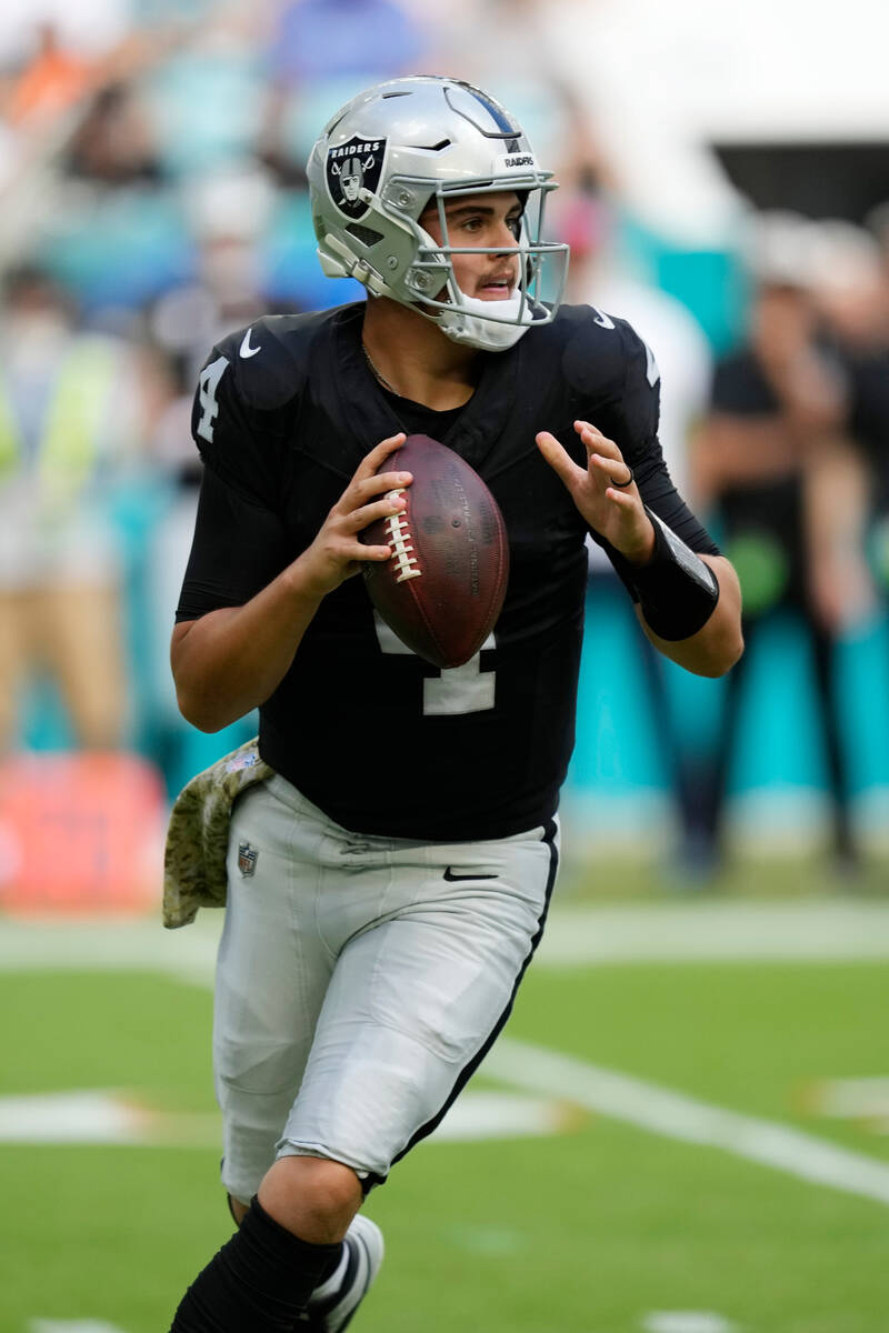 Las Vegas Raiders quarterback Aidan O'Connell (4) aims a pass during the first half of an NFL f ...