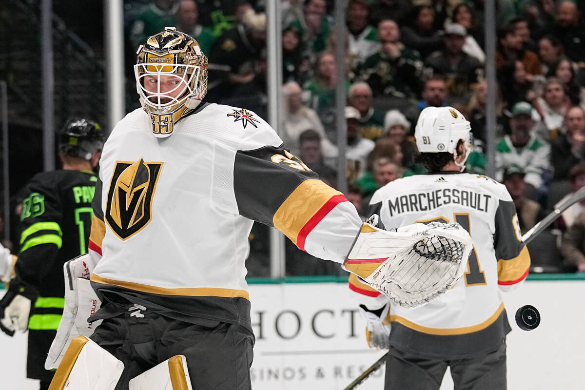 Vegas Golden Knights goaltender Adin Hill releases the puck after making a save against the Dal ...