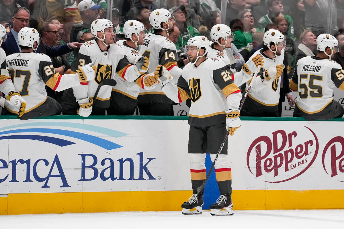 Vegas Golden Knights right wing Michael Amadio (22) skates by his bench after scoring a power p ...