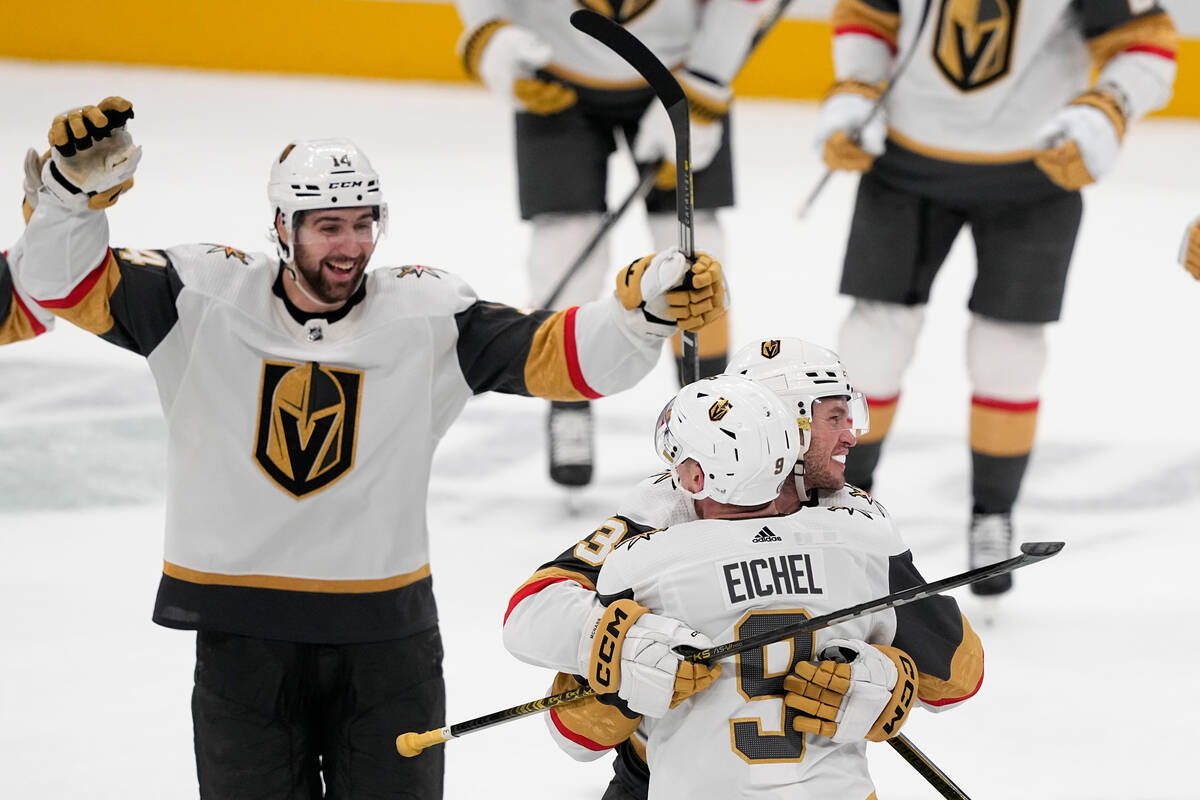 Vegas Golden Knights center Jack Eichel (9) celebrates with teammates his game-winning goal aga ...