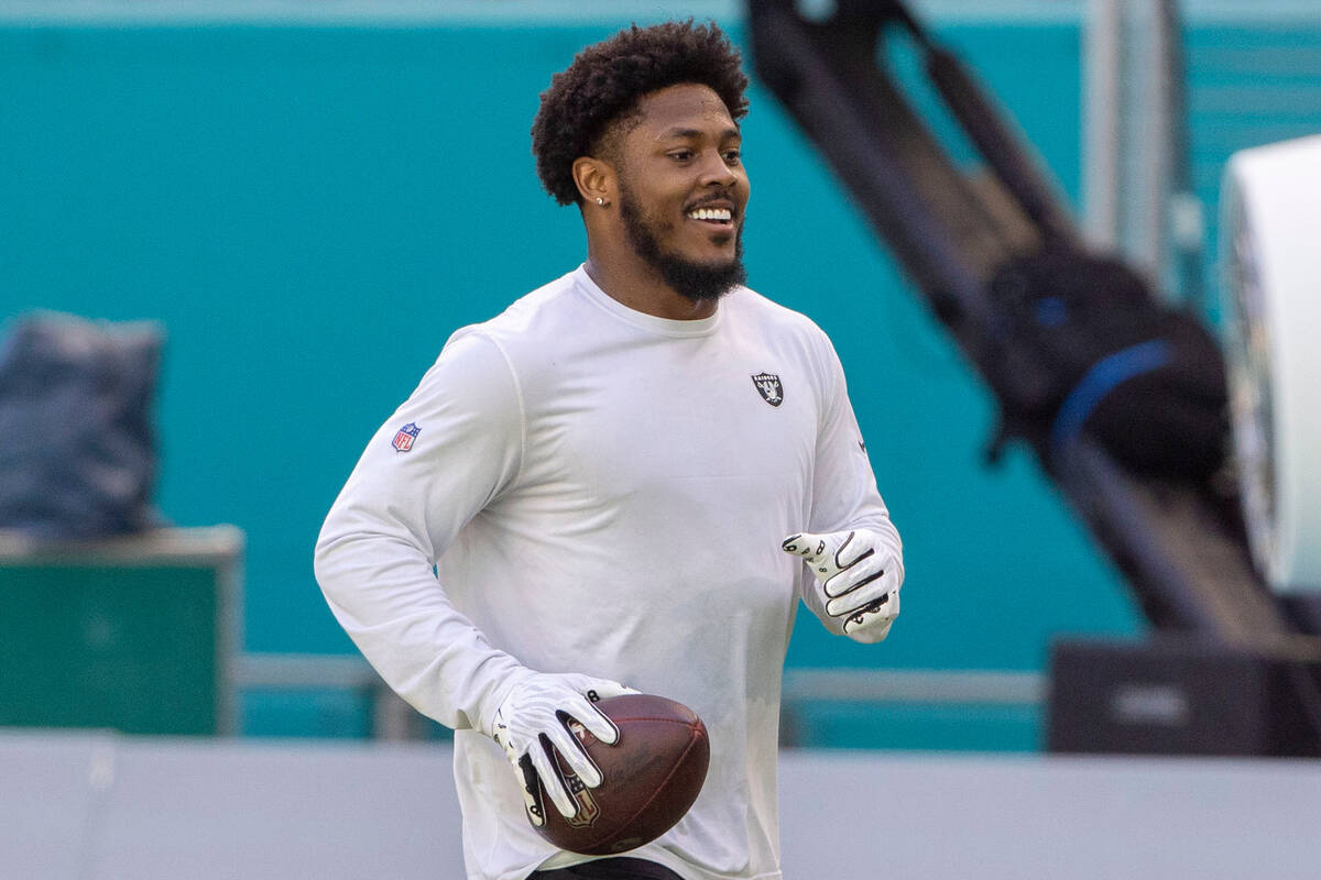 Raiders running back Josh Jacobs warms up before an NFL game against the Miami Dolphins on Sund ...