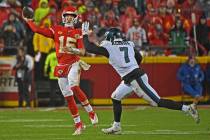 Kansas City Chiefs quarterback Patrick Mahomes (15) throws a pass down field against pressure f ...