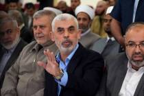 FILE - Yahya Sinwar, head of Hamas in Gaza, greets his supporters upon his arrival at a meeting ...