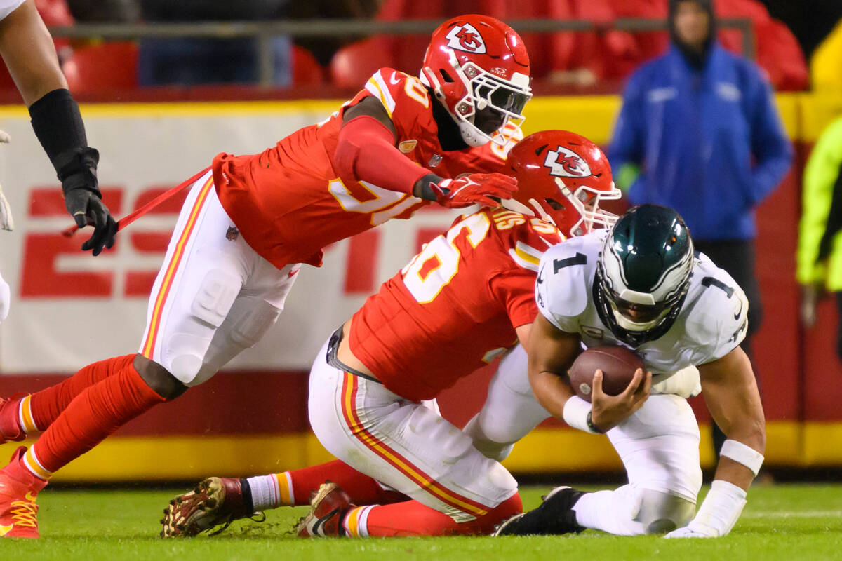 Kansas City Chiefs defensive end George Karlaftis (56) and Chiefs defensive end Charles Omenihu ...