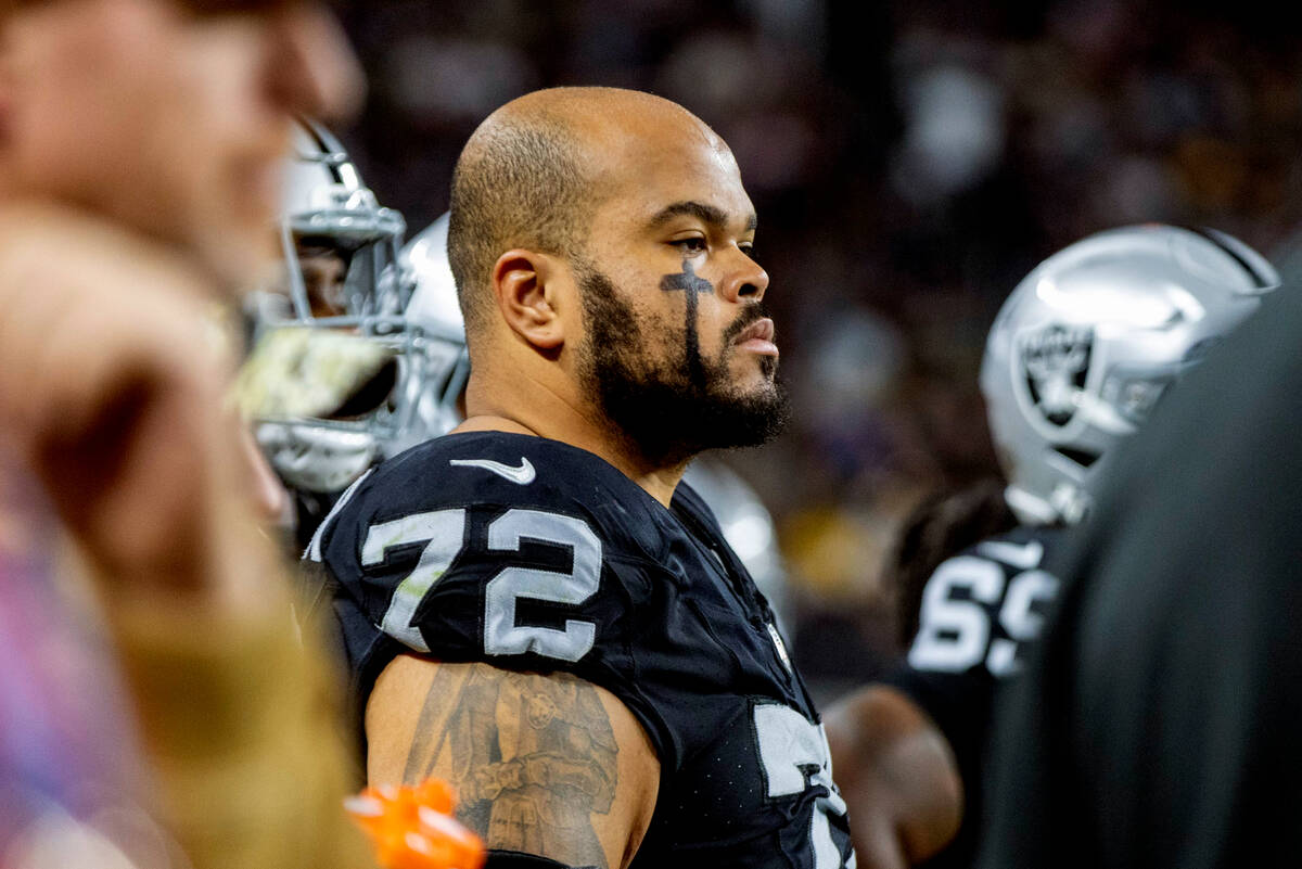 Raiders offensive tackle Jermaine Eluemunor (72) looks on from the sideline during the first ha ...