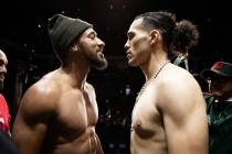 Demetrius Andrade (left) faces off with David Benavidez (right) at the weigh-in for their WBC s ...
