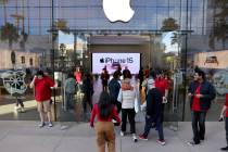 Shoppers file into the Apple Store as the doors open shortly before 8 a.m. at Downtown Summerli ...