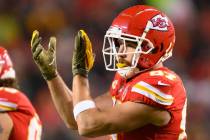 Kansas City Chiefs tight end Travis Kelce cheers during an announcement honoring servicemen and ...