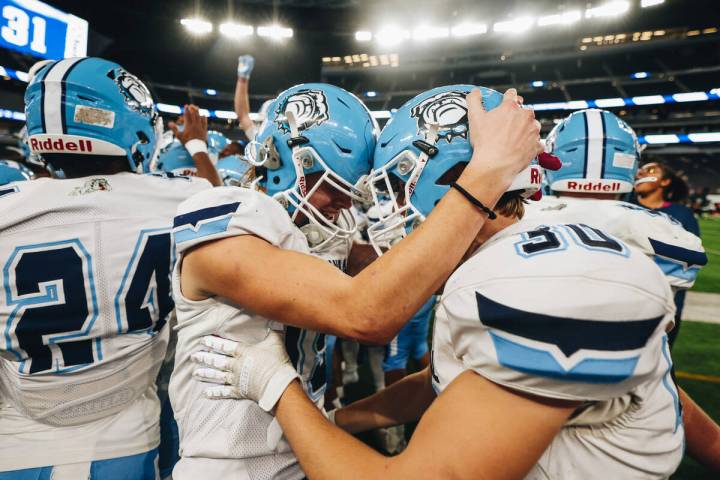 Centennial players celebrate a state championship win over Sunrise Mountain during a class 4A s ...