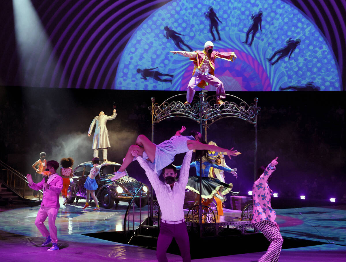 Cast members perform during the grand reopening of "The Beatles LOVE By Cirque du Soleil" at Th ...