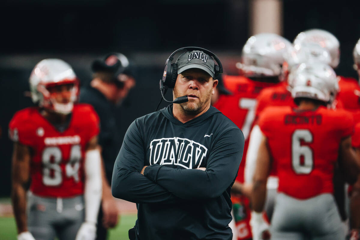 UNLV head coach Barry Odom stands during a time out during a game against San Jose State at All ...