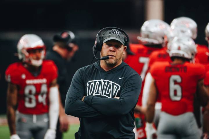 UNLV head coach Barry Odom stands during a time out during a game against San Jose State at All ...