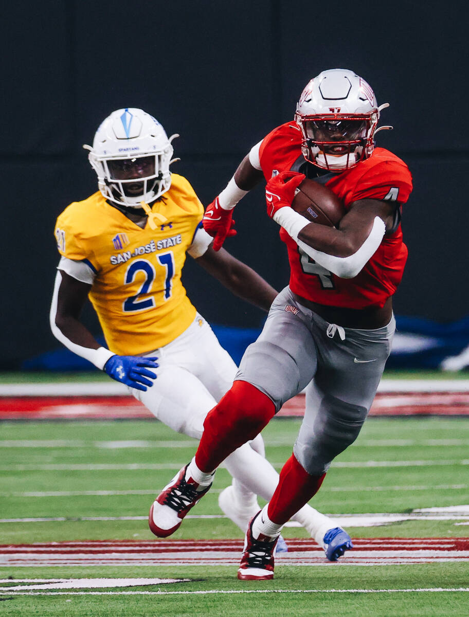 UNLV running back Donavyn Lester (4) runs the ball during a football game against San Jose Stat ...