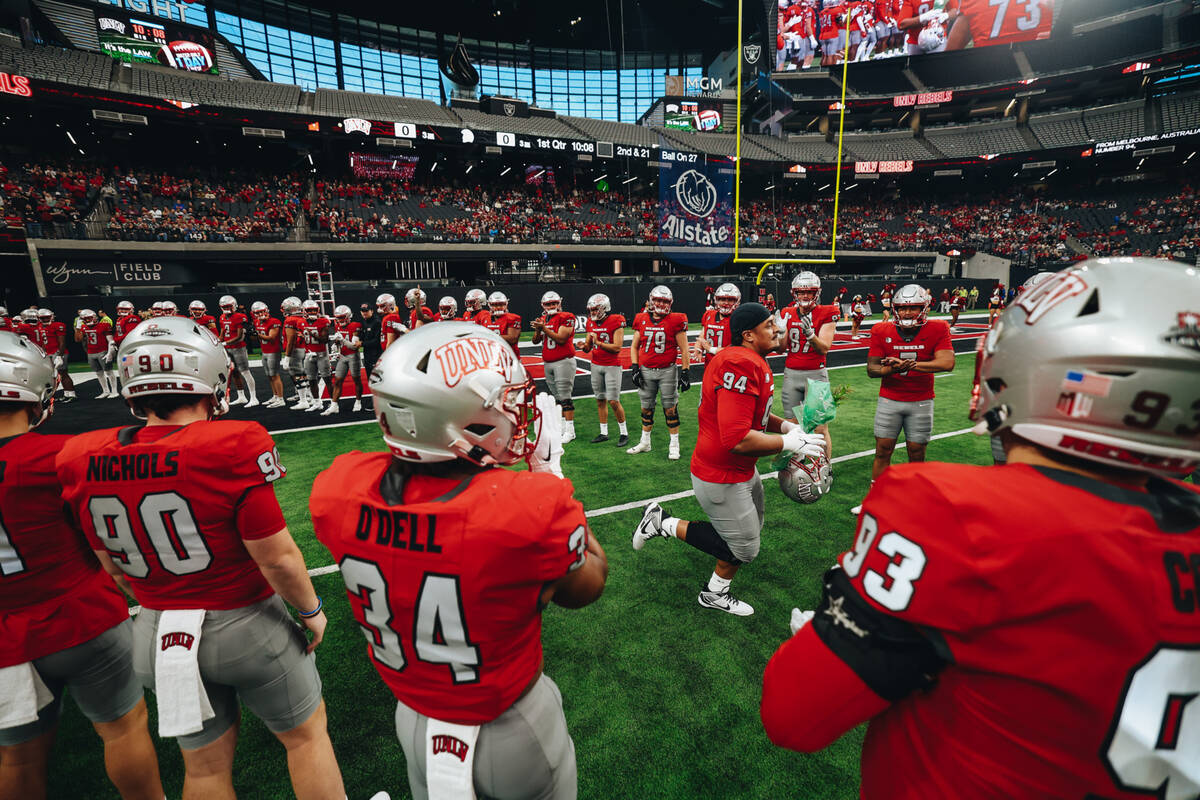 UNLV defensive lineman Ben Key (94) runs onto the field to be honored during Senior Day before ...