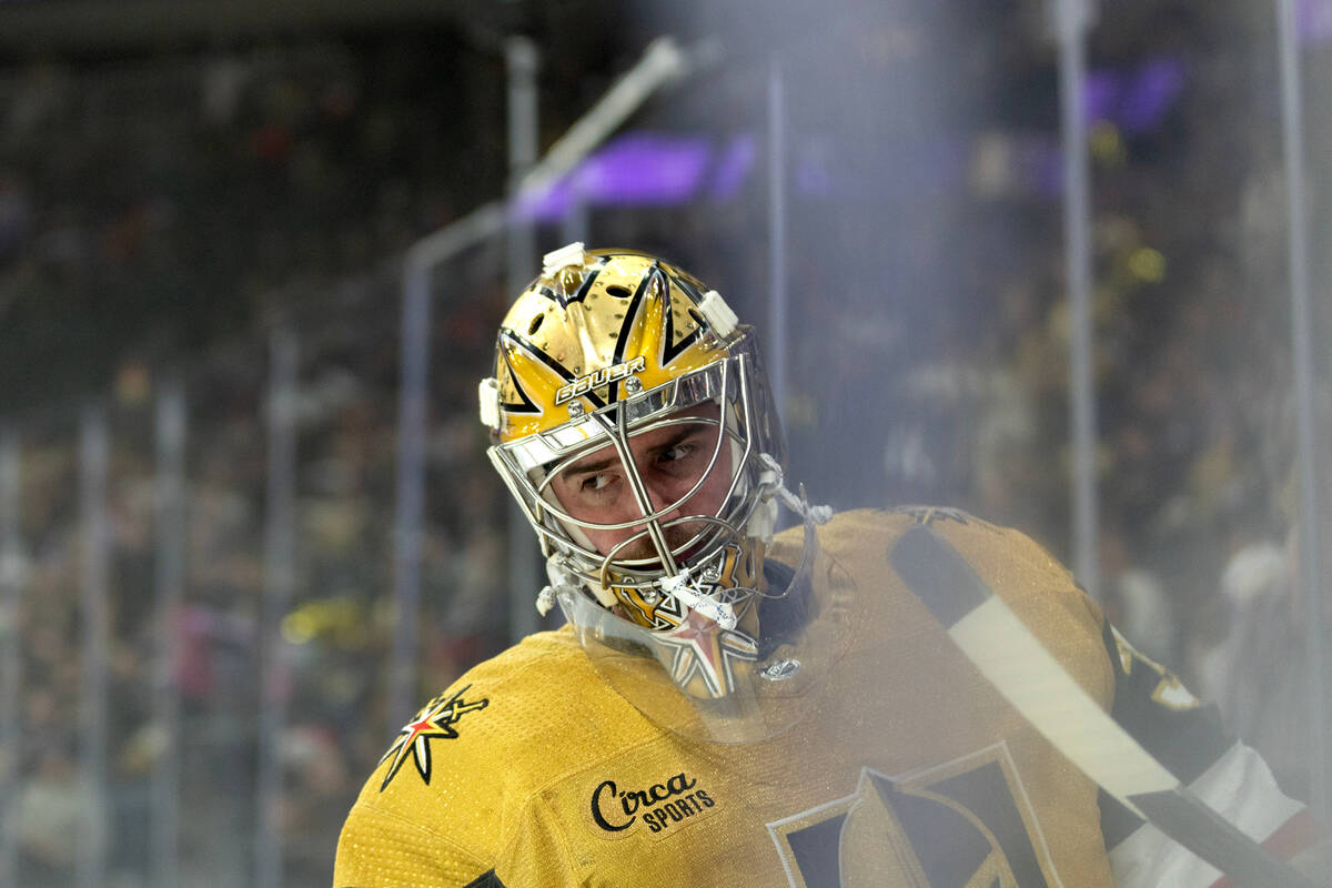 Golden Knights goaltender Logan Thompson skates around the net during the first period of an NH ...