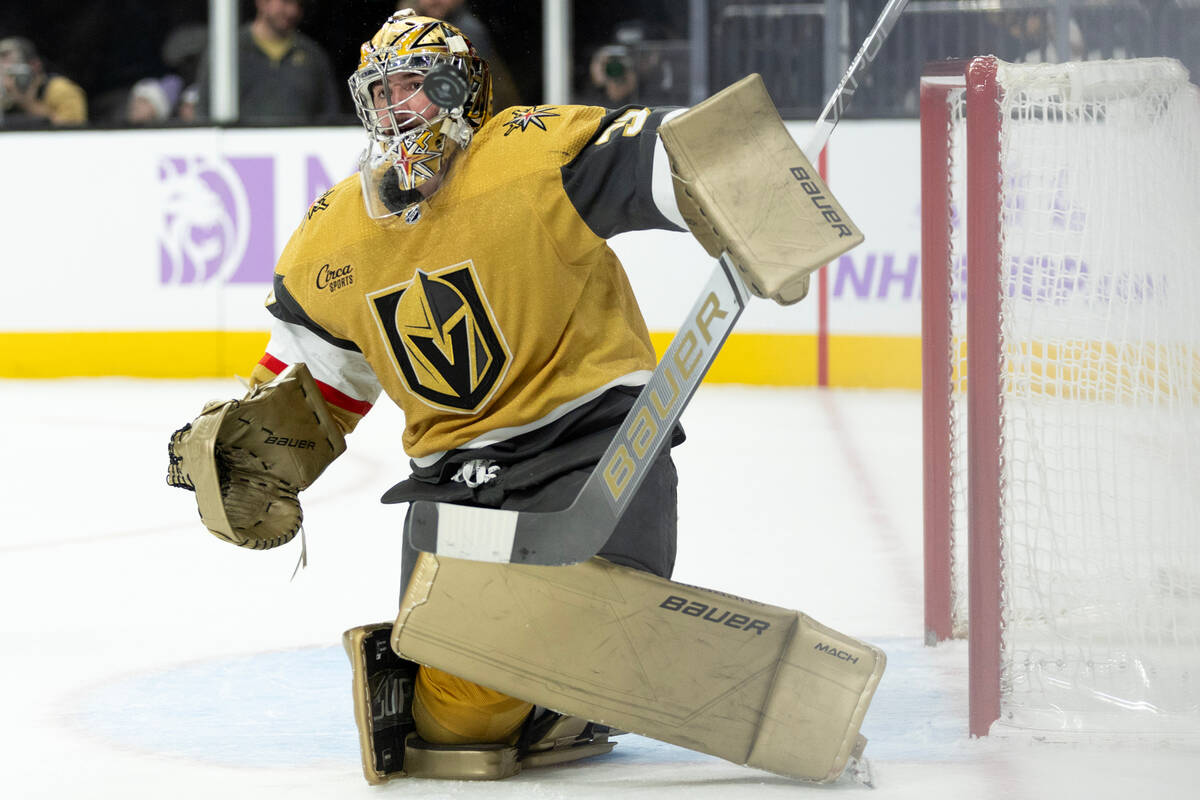 Golden Knights goaltender Logan Thompson (36) saves the puck during the third period of an NHL ...