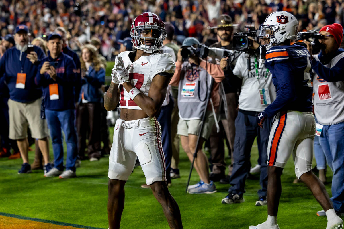 Alabama wide receiver Isaiah Bond (17) reacts after catching a touchdown pass in the final minu ...