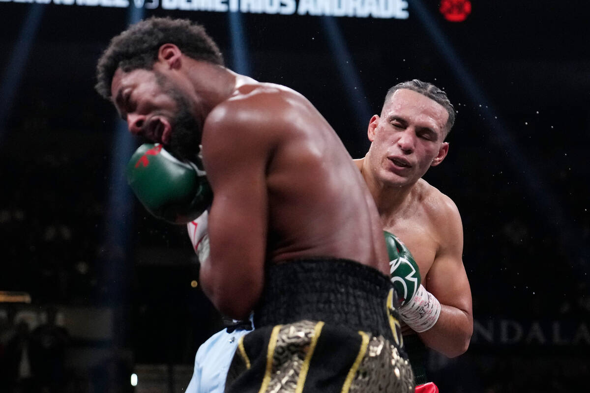 David Benavidez hits Demetrius Andrade during a super middleweight boxing match Saturday, Nov. ...