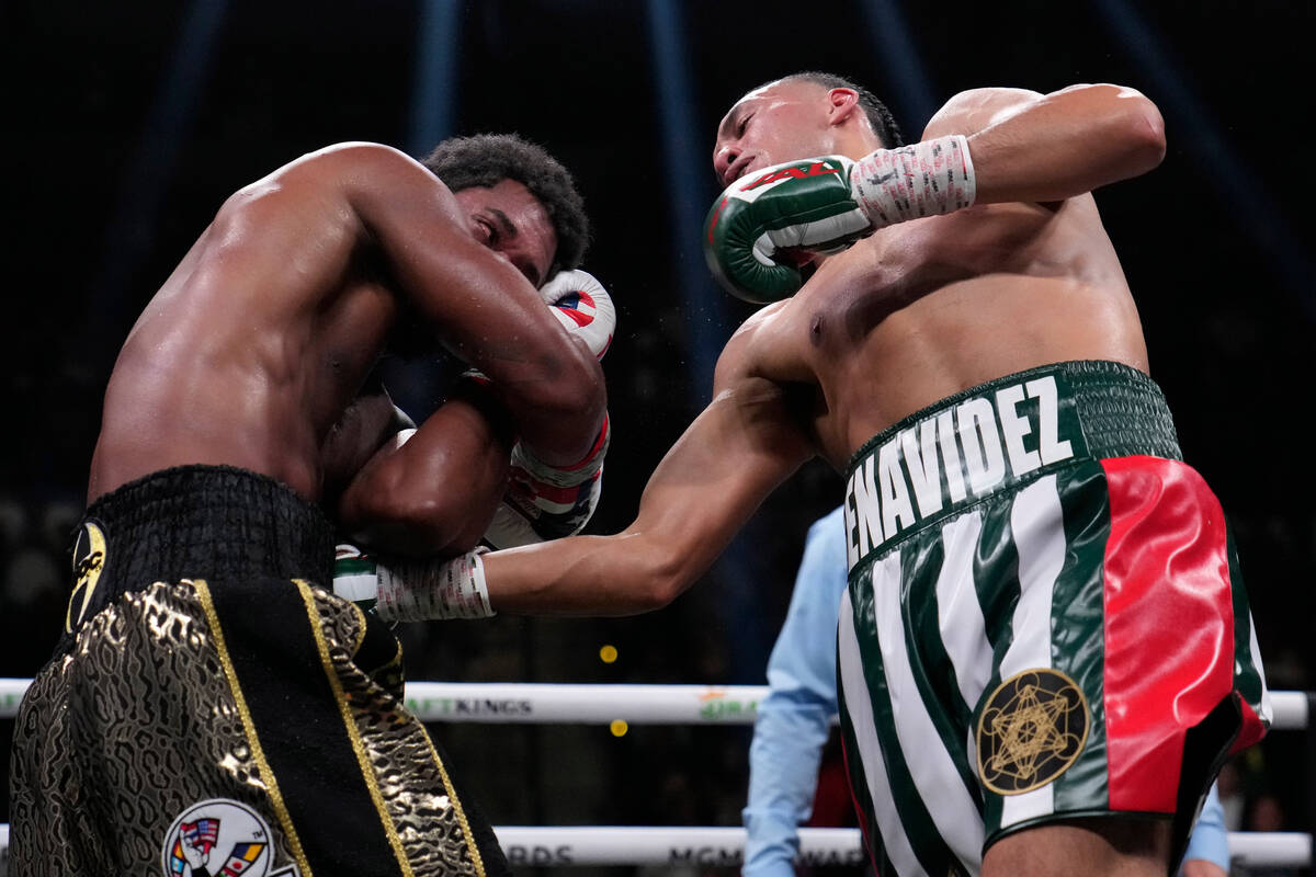 David Benavidez hits Demetrius Andrade during a super middleweight boxing match Saturday, Nov. ...