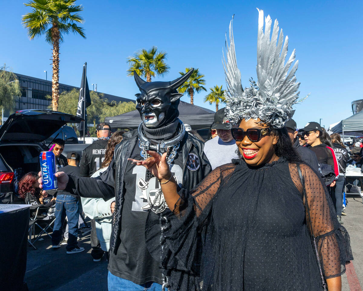 Raiders characters greet others in tailgating before the first half of the Raiders versus the K ...